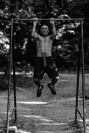 Senior exercising outdoors