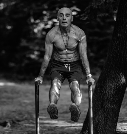 Senior exercising outdoors