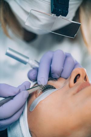 Cosmetologist Doing Lash Liftingの写真素材
