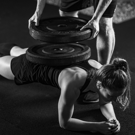Cross training. Young athletes with heavy barbellsの写真素材