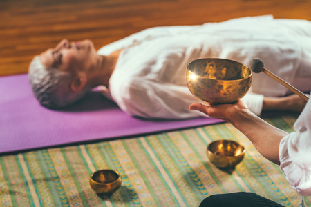 Tibetan singing bowl in sound meditation therapyの写真素材