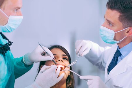  Dentists Working with Young Female Patientの写真素材