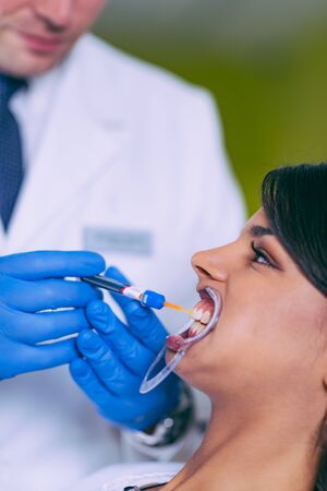  Pretty young woman at dentistの写真素材