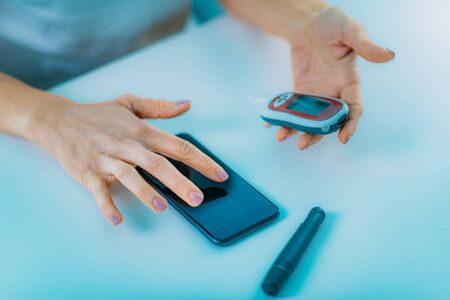 Mobile health - Measuring Glucose Levels and Using Smart Phoneの写真素材