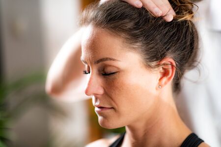 Osteopathy Treatment. Osteopathist Working with Female Patientの写真素材