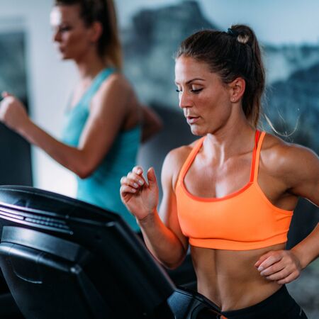 Young Women Exercising on Treadmill.の写真素材