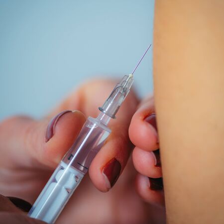 Woman Getting a Flu Vaccineの写真素材