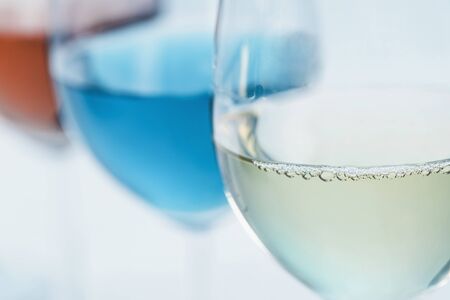 Wine Selection. Four glasses with different wines on table â red, rose, white and blue wineの写真素材