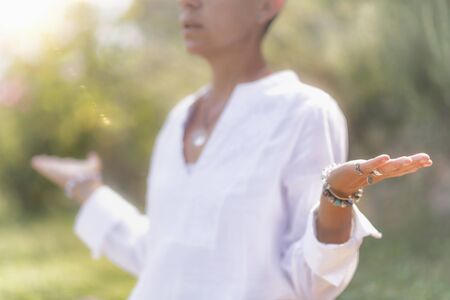 Feeling in Balance. Balancing energy meditation outdoors. Self-care wellbeing practice 