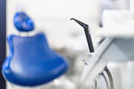 Dentist office with blue dentistry chair and dental equipmentの写真素材