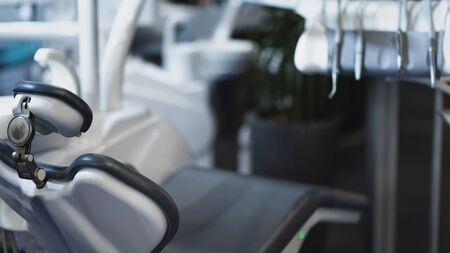 Modern black dentist chair in dentist office.の写真素材