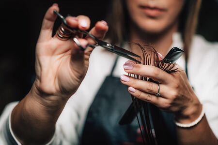 Close-up of a hairdresser cutting womanâs hair.の写真素材