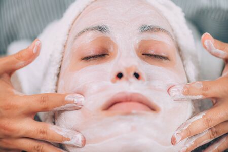 Skin rejuvenating face mask, close-up of a young womanâs face の写真素材