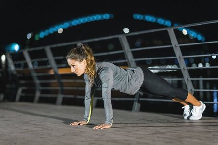 Urban Exercising Outdoors Late at Night in the Cityの写真素材