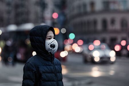 Polluted Air in the City. Wearing protective Mask