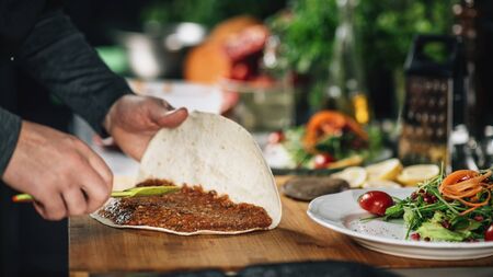 Vegan burrito -  Chef in restaurant preparing vegan meal の写真素材