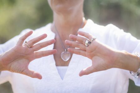 Wellbeing Coach, Middle Aged Woman Practicing Mindful Acceptance Meditation. Positive Mindset Conceptの写真素材