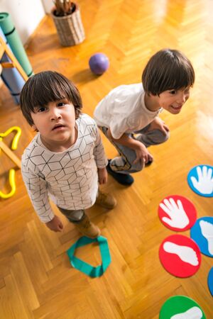 Children Playing Twister in Kindergarten