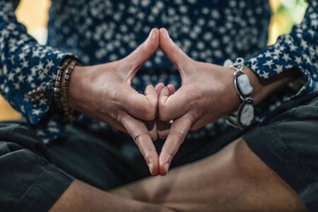 Kalesvara Mudra or Mind Calming Mudra. Hand Gesture holding fingers in Kalesvara Mudra for meditation, self-healing and better control of thoughts and emotions.の写真素材