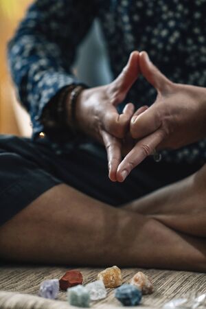 Kalesvara Mudra or Mind Calming Mudra. Hand Gesture holding fingers in Kalesvara Mudra for meditation, self-healing and better control of thoughts and emotions.の写真素材