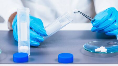 Placebo Blinded Study â€“ Scientist Separating Real and Inert Tablets for Placebo Controlled...