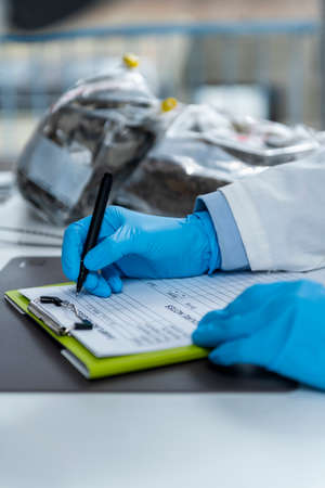 Organic Certification Laboratory. Filling a Form for Organic Certification Procedure in Laboratory