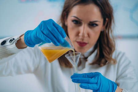 Pharmacist Making Beauty Cosmetic Cream with Bee Propolisの写真素材