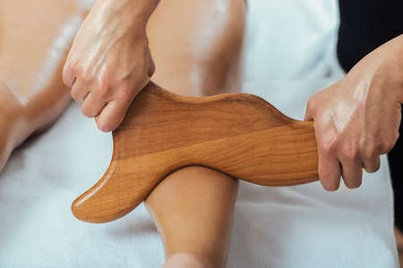 Madero therapy anti cellulite massage of female leg calves in a wellness centerの写真素材