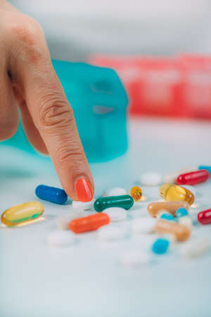 Polypharmacy issue. Large amount of medications outside a bottle.