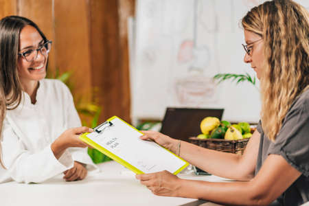 Functional medicine practitioner giving personal health report to the client