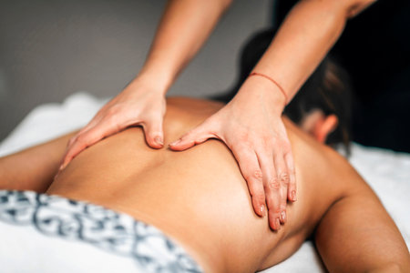 Lomi Lomi Hawaiian back massage at a wellness centerの写真素材