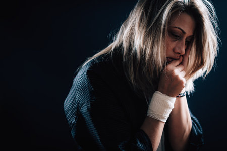 Dark portrait of depressed woman, depression disorder conceptの写真素材