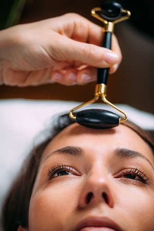 Guasha Face Massage with Jade Stone Rollerの写真素材