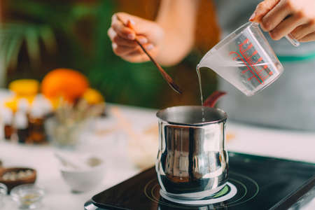 Pouring Water and Making Homemade Soap.の写真素材
