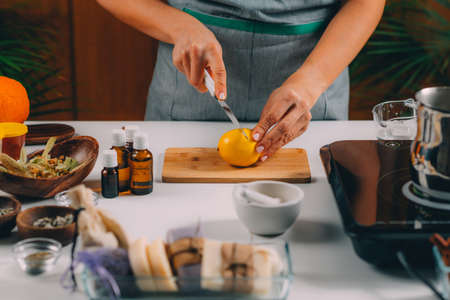 Woman Cutting Lemon for Homemade Soapの写真素材