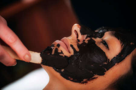 Chocolate facial mask. Beauty treatment for the faceの写真素材