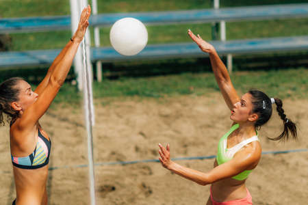Beach Volleyball Female Player on the Netの写真素材