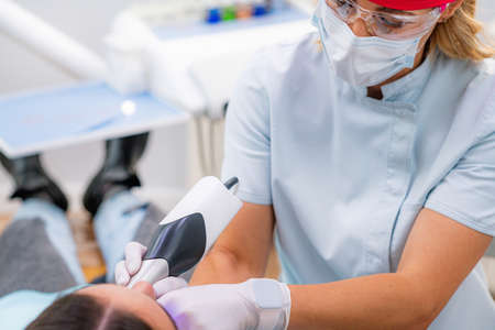 Prosthetic Dentistry. Scanning Teeth with Dental Camera. 3d Camera in Tooth Reconstruction Procedureの写真素材