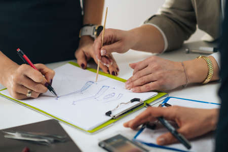 Microblading eyebrows education in beauty esthetic center. Female artist sketching eyebrows with studentsの写真素材