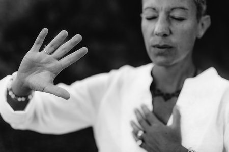 Spiritual Coach Sending Positive Thoughts Hand Gestureの写真素材