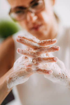 Obsessive compulsive disorder concept. Woman obsessively washing her hands.