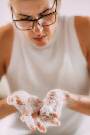 Obsessive compulsive disorder concept. Woman obsessively washing her hands.