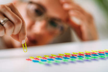 Obsessive compulsive disorder. Arranging Paperclips in a Row.