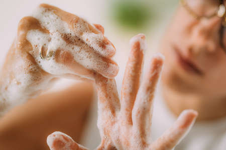 Obsessive compulsive disorder concept. Woman obsessively washing her hands.