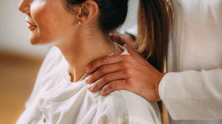 Woman enjoying shiatsu neck and shoulders massage.の写真素材