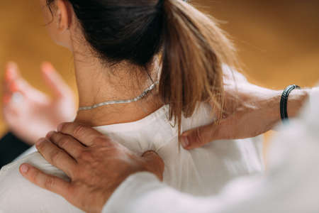 Woman enjoying shiatsu neck and shoulders massage.の写真素材
