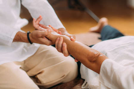 Shiatsu Hand Massage. Therapist activating the heart meridian.の写真素材