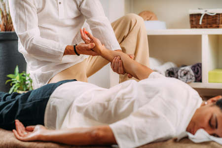 Shiatsu Hand Massage. Therapist massaging the heart meridian.の写真素材