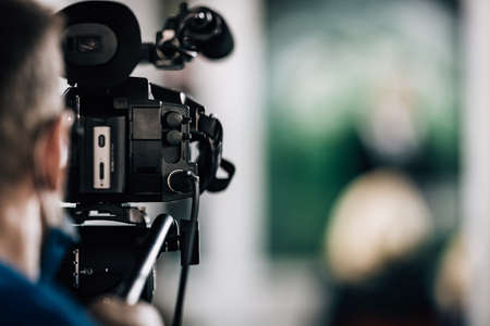 Cameraman Recording a Media Eventの写真素材