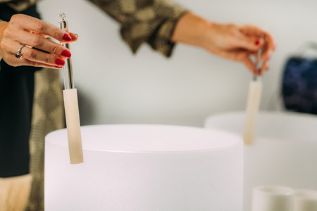 Crystal singing bowls in a sound healing therapy sessionの写真素材